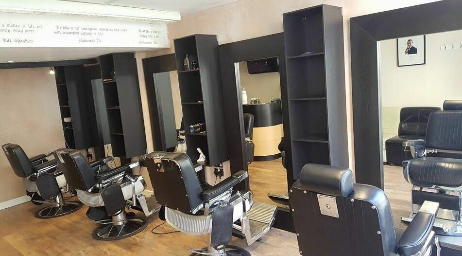 Modern barber chairs at The Barbers Chair, Southwell, England, GB, showcasing stylish interior design.