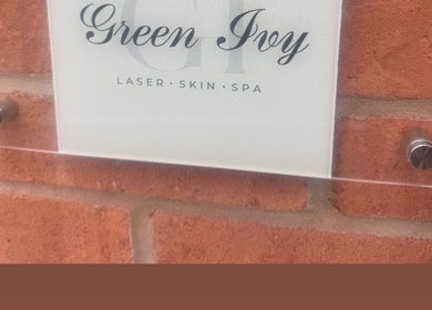 Sign for Green Ivy Skin and Spa on brick wall, Barton Seagrave, England, GB.
