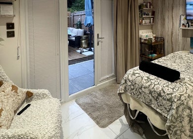 Relaxing treatment room at Green Ivy Skin and Spa in Kettering, England, GB with cozy decor.