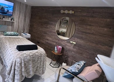Relaxing treatment room at GREEN IVY SKIN & SPA, Kettering, England, GB featuring a cozy bed and modern decor.