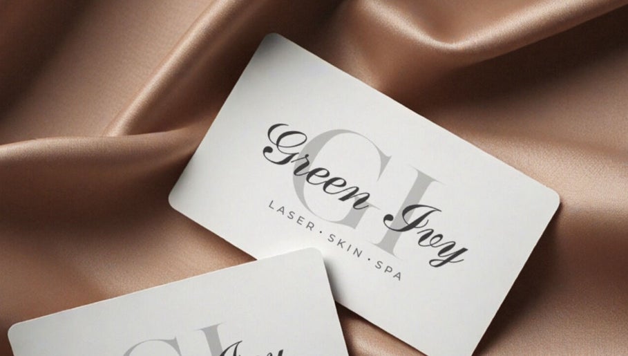 Elegant cards displaying 'Green Ivy Skin And Spa' logo on satin, Kettering, England, GB.