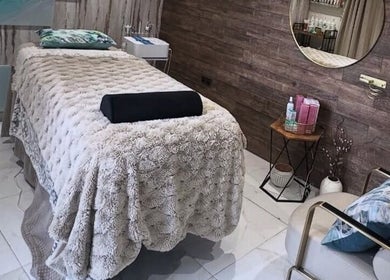 Tranquil spa room at Green Ivy Skin And Spa in Kettering, England, GB, featuring cozy massage bed.