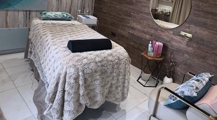 Tranquil spa room at Green Ivy Skin And Spa in Kettering, England, GB, featuring cozy massage bed.