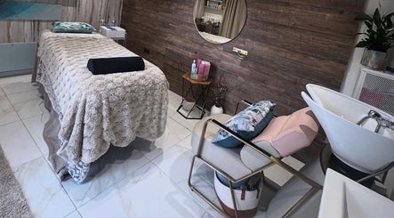 Relaxing spa treatment room at Green Ivy Skin And Spa, Barton Seagrave, England, GB.