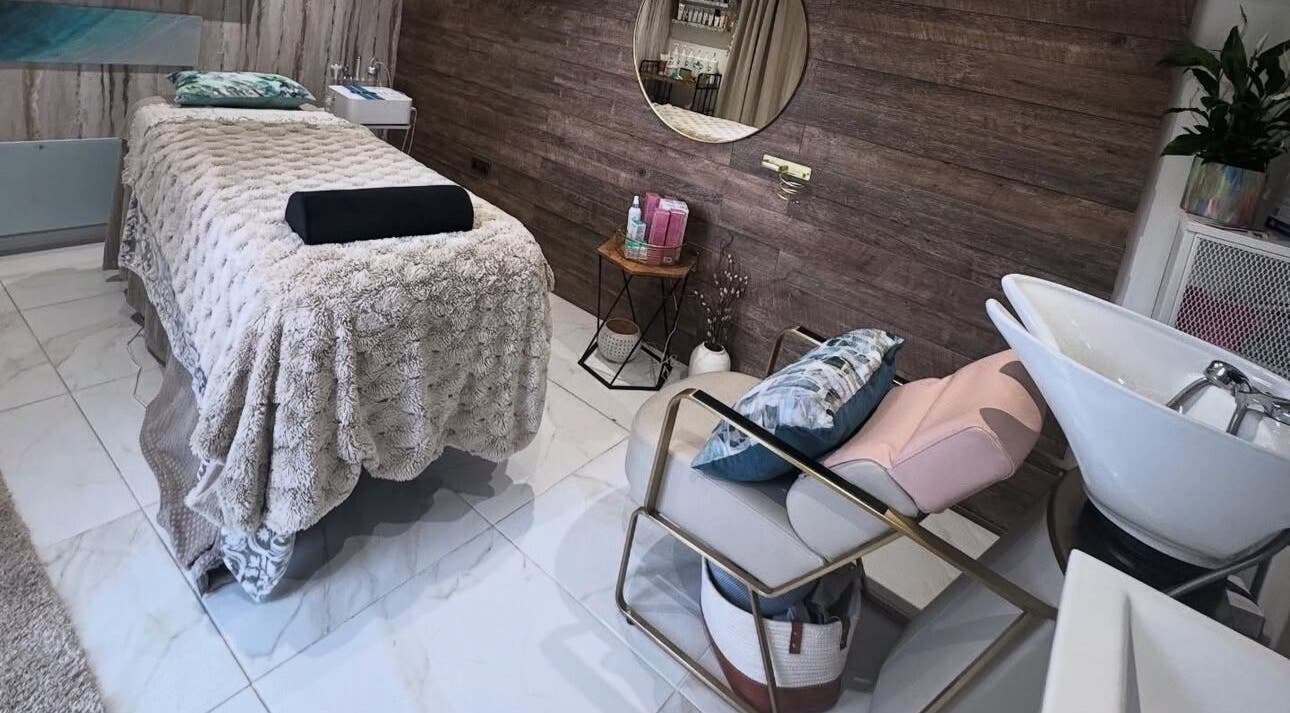 Relaxing spa room at Green Ivy Skin And Spa, Barton Seagrave, England, GB, featuring a cozy massage table.