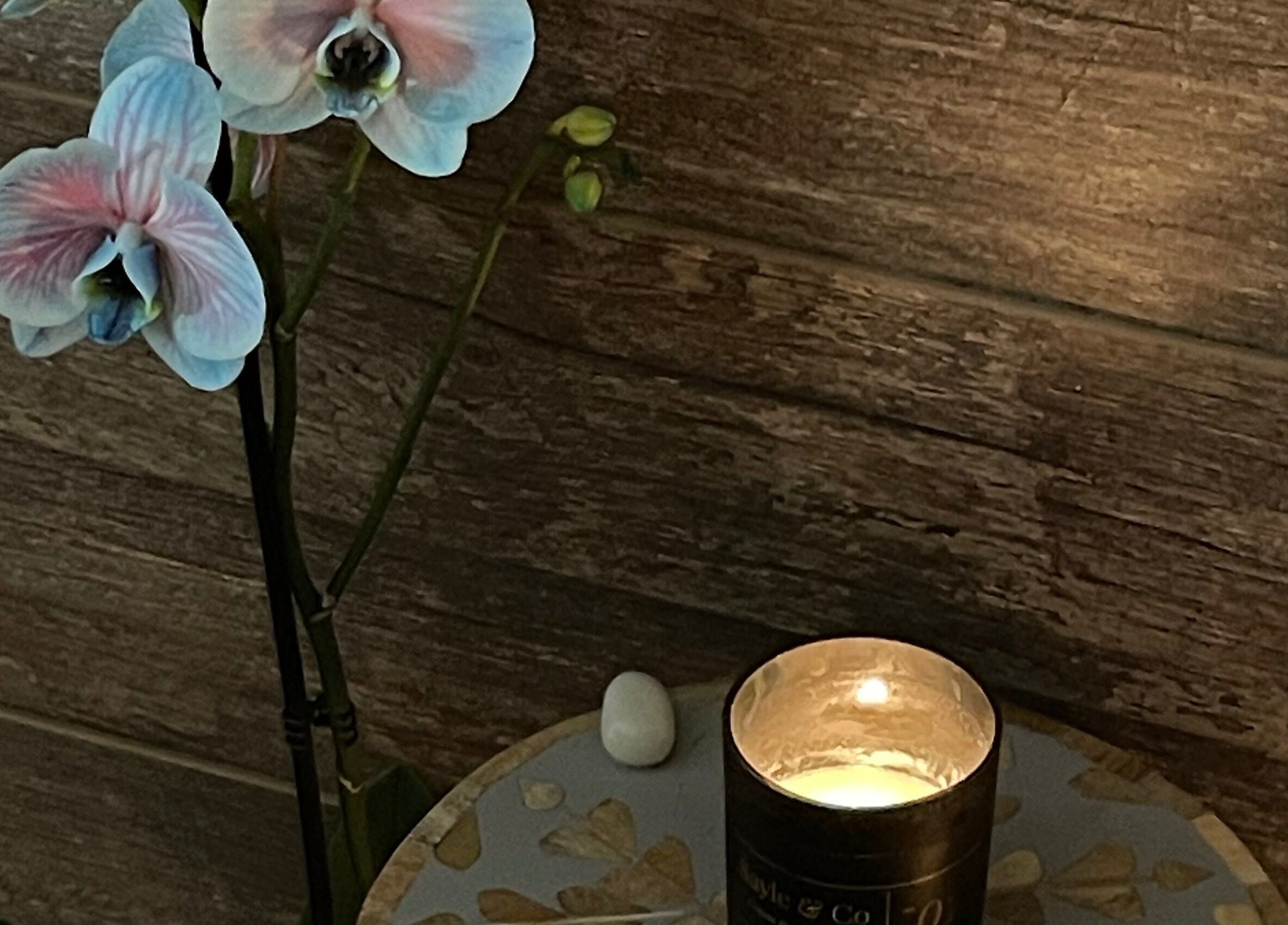 Candlelit orchid ambiance at Green Ivy Skin And Spa, Barton Seagrave, England, GB.
