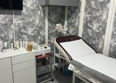 Beauty by Jen's serene treatment room, Liverpool, England, GB, showcasing spa essentials and decor.