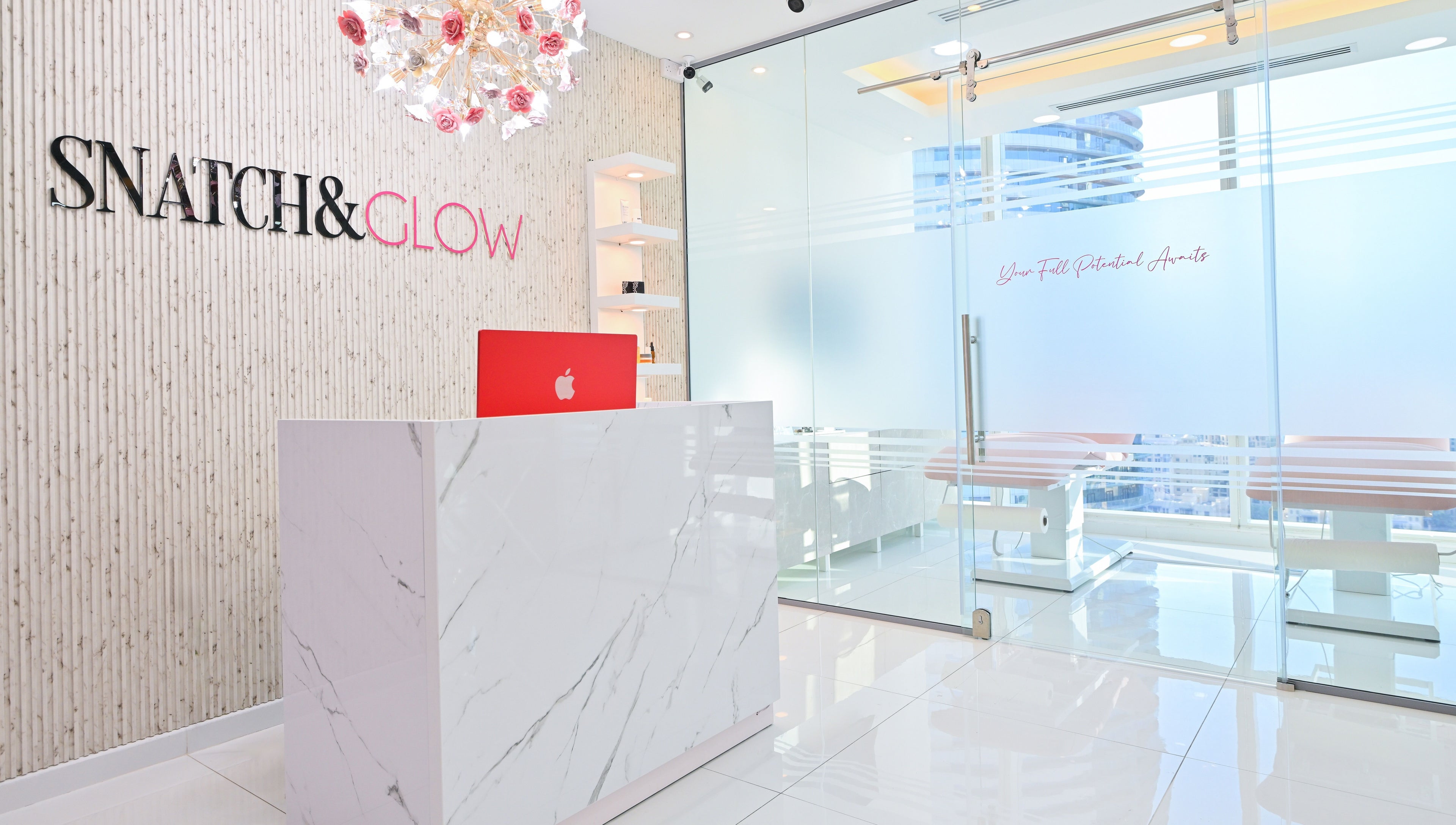 Reception area of Snatch & Glow London in Dubai, Dubai, AE, showcasing modern decor with a sleek design.
