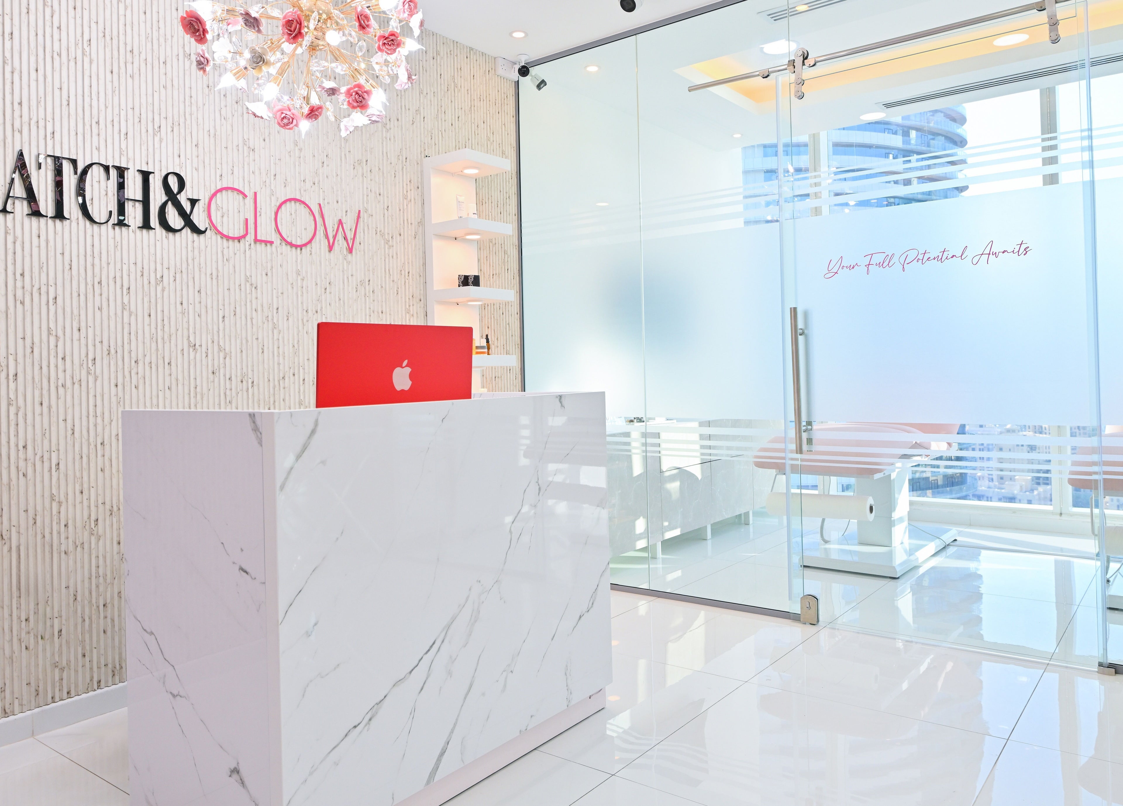 Reception area of Snatch & Glow London in Dubai, Dubai, AE, showcasing modern decor with a sleek design.