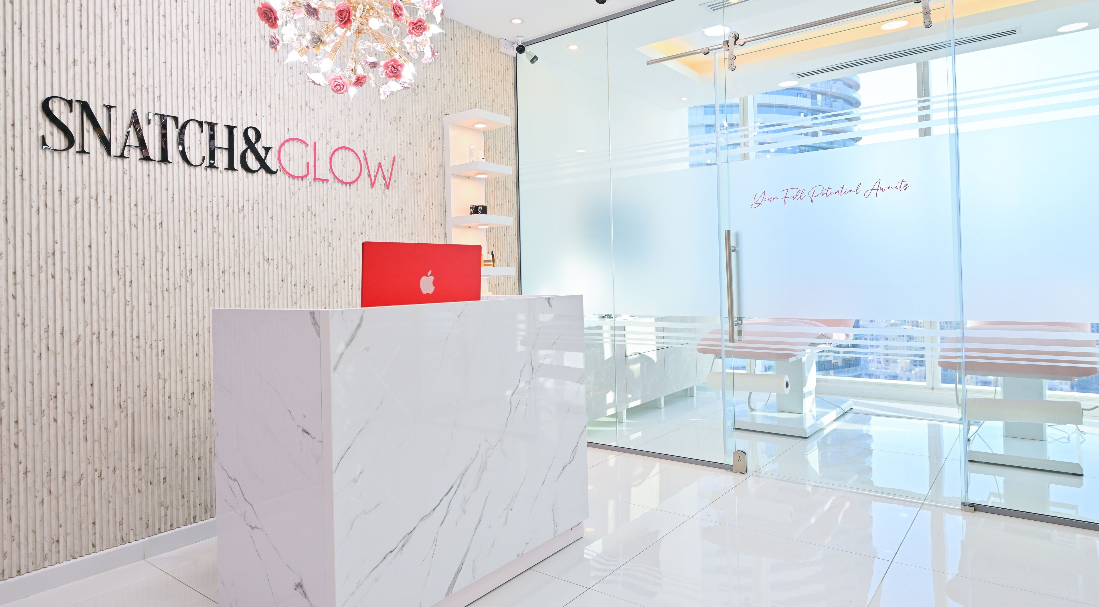 Reception area of Snatch & Glow London in Dubai, Dubai, AE, showcasing modern decor with a sleek design.