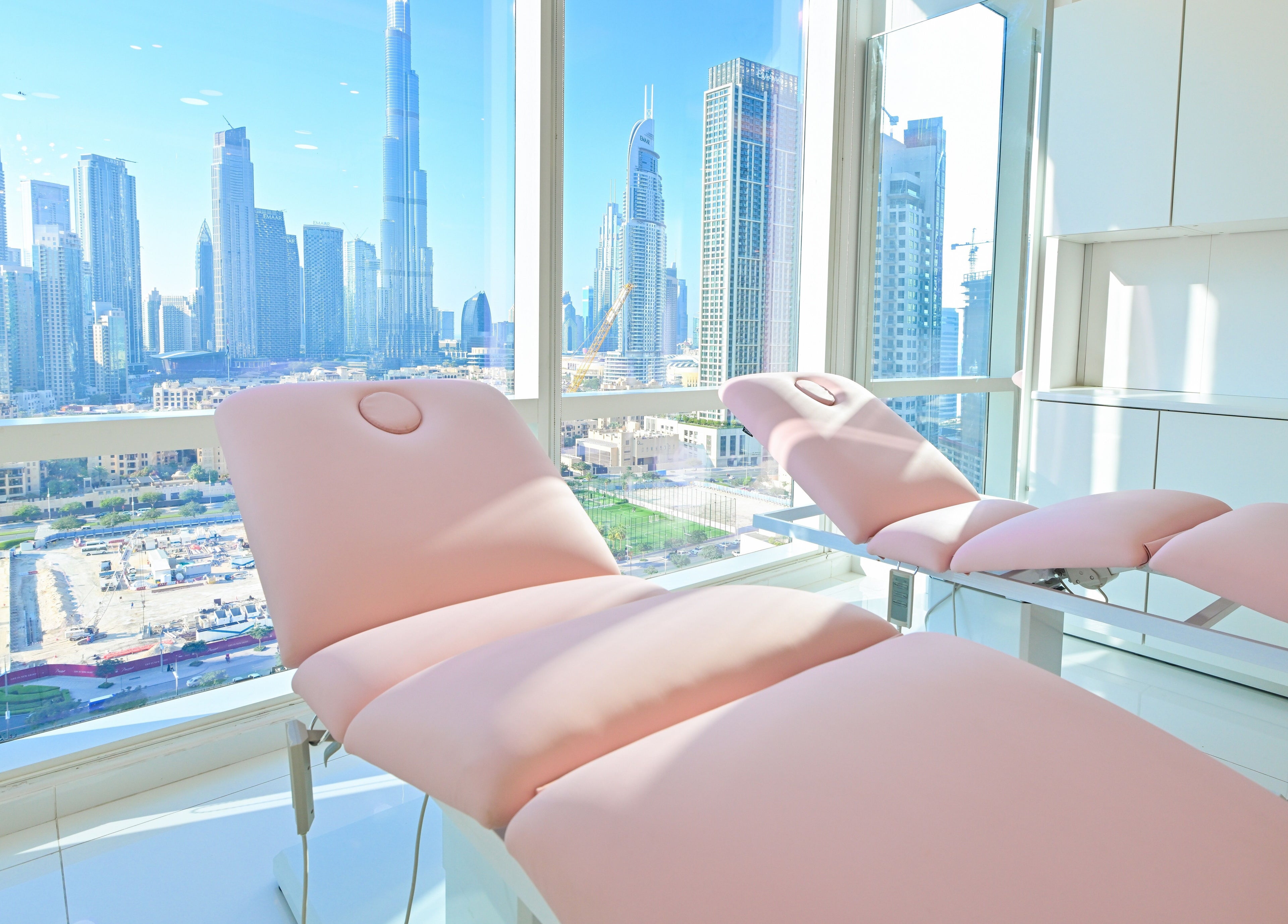 Relaxing treatment room at Snatch & Glow London with Dubai skyline view in Dubai, Dubai, AE.