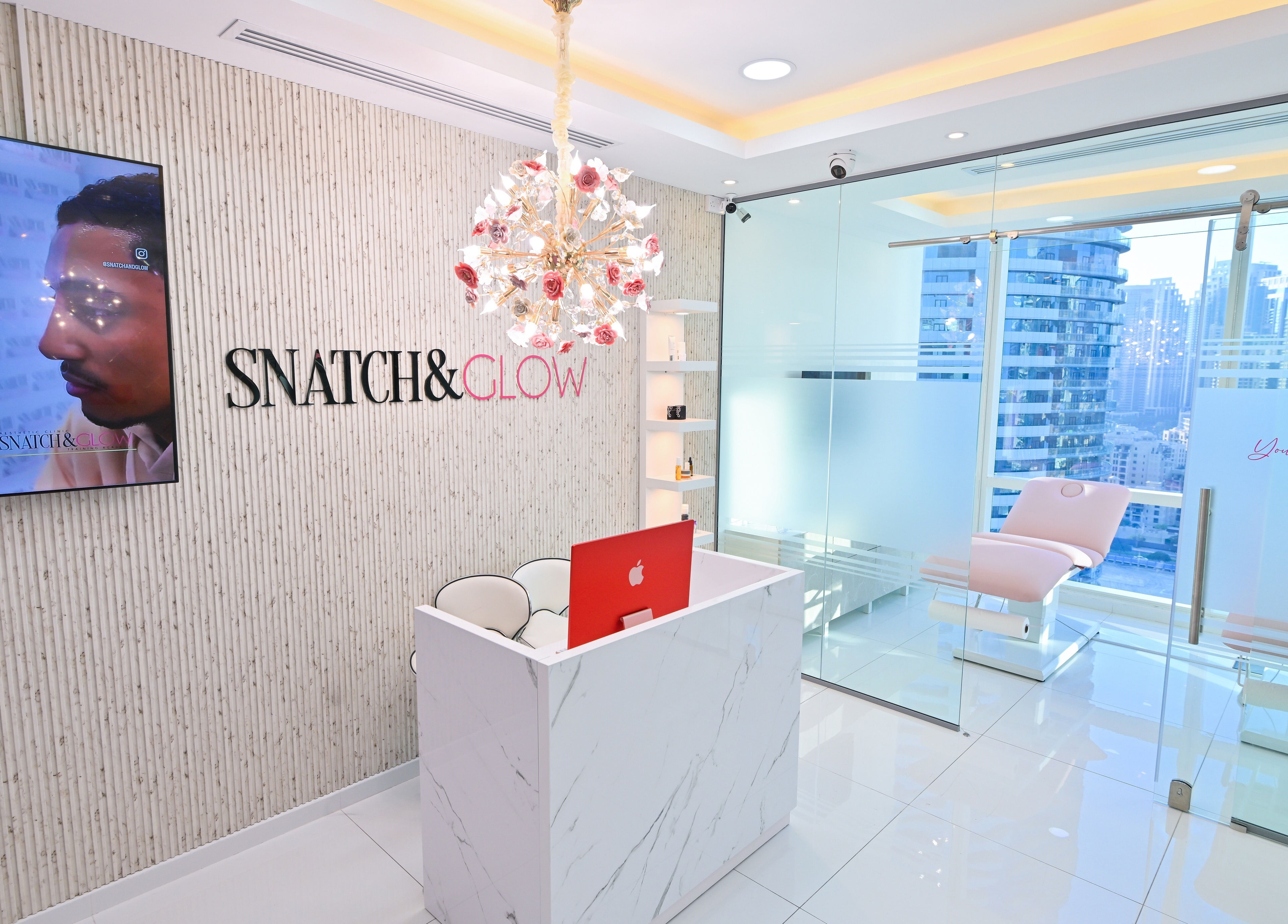 Elegant reception area at Snatch & Glow London, Dubai, Dubai, AE with chic decor and a stunning city view.