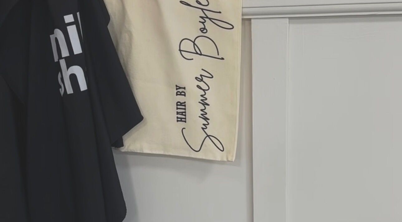 Custom towel with 'Hair by Summer Boyle' logo at Bursledon, England, GB.