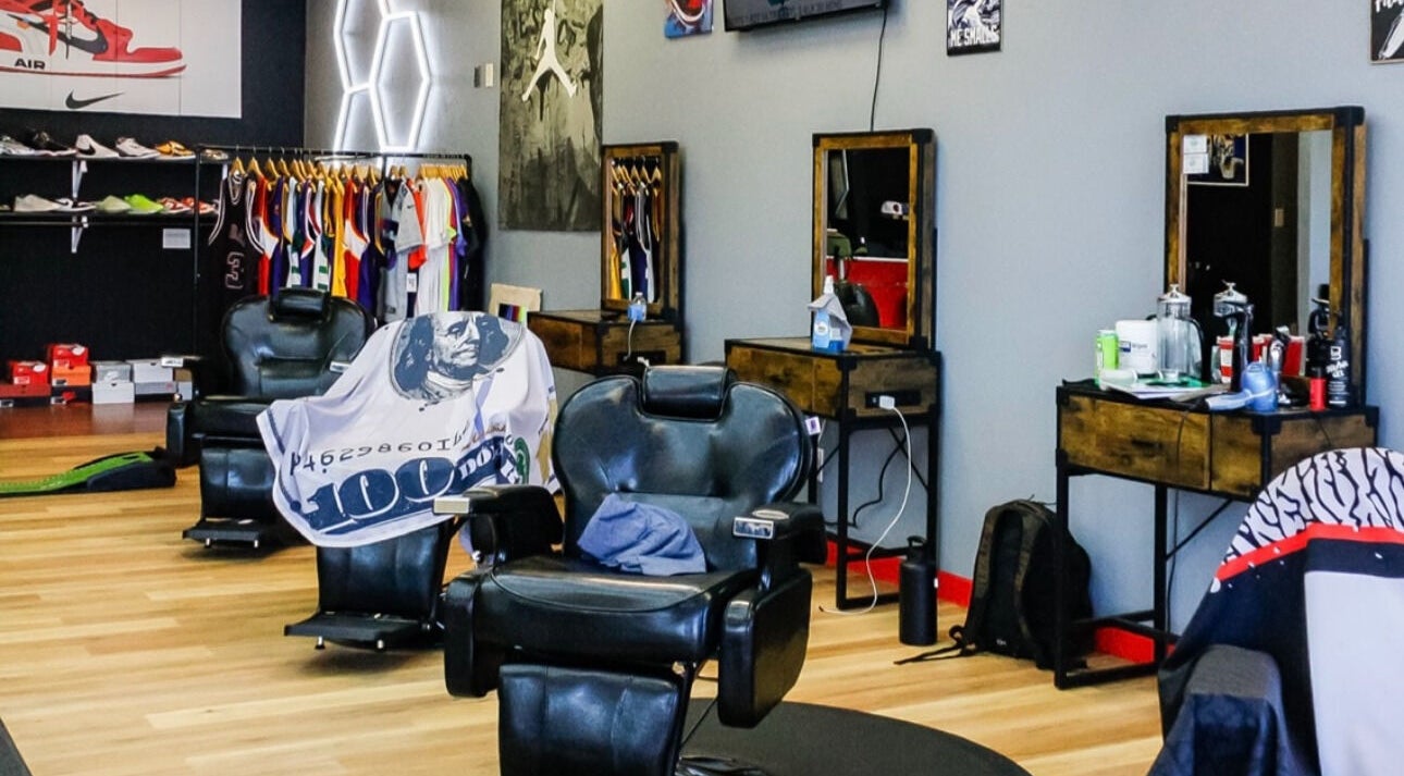 Stylish barber chairs at Kicks And Fades Barbering Co in Idaho Falls, Idaho, US, with vibrant decor.