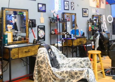 Interior of Kicks And Fades Barbering Co in Idaho Falls, Idaho, US, showcasing stylish barber chairs and decor.