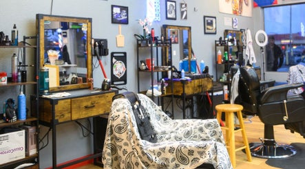 Interior of Kicks And Fades Barbering Co in Idaho Falls, Idaho, US, showcasing stylish barber chairs and decor.