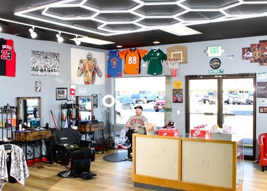 Modern interior of Kicks And Fades Barbering Co in Idaho Falls, Idaho, US showcasing stylish decor and seating.