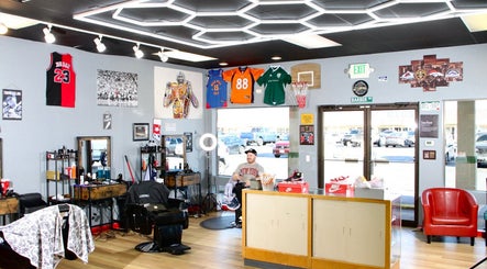 Modern interior of Kicks And Fades Barbering Co in Idaho Falls, Idaho, US showcasing stylish decor and seating.