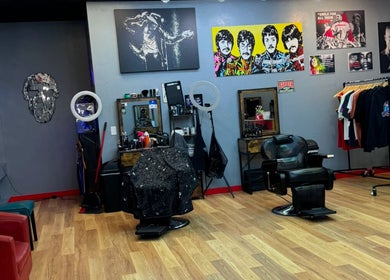 Interior of Kicks And Fades Barbering Co, featuring chairs and art in Idaho Falls, Idaho, US.