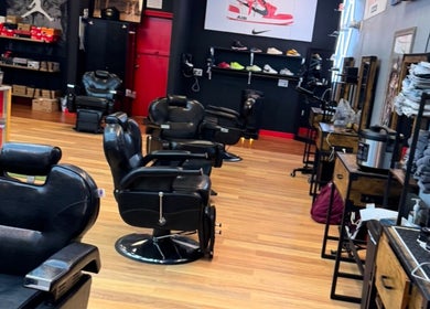 Stylish interior of Kicks And Fades Barbering Co in Idaho Falls, Idaho, US showcasing modern barber chairs.