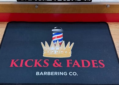 Entrance mat with Kicks And Fades Barbering Co logo in Idaho Falls, Idaho, US.