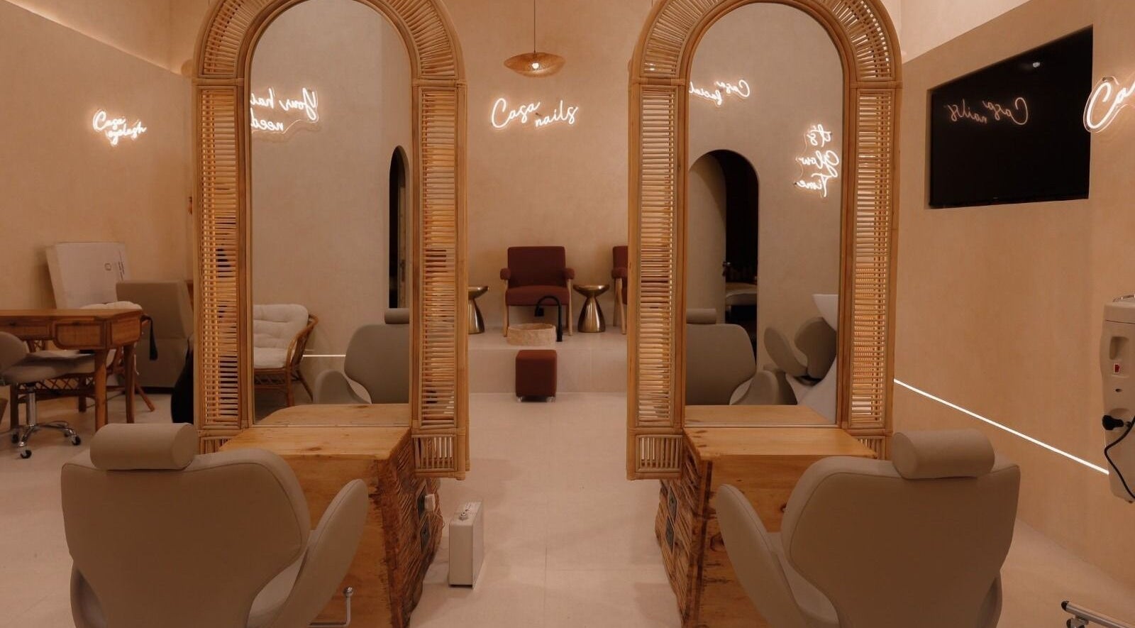Chic interior of Casa Rio Beauty Salon in Dubai, Dubai, AE, featuring elegant mirrors and plush chairs.
