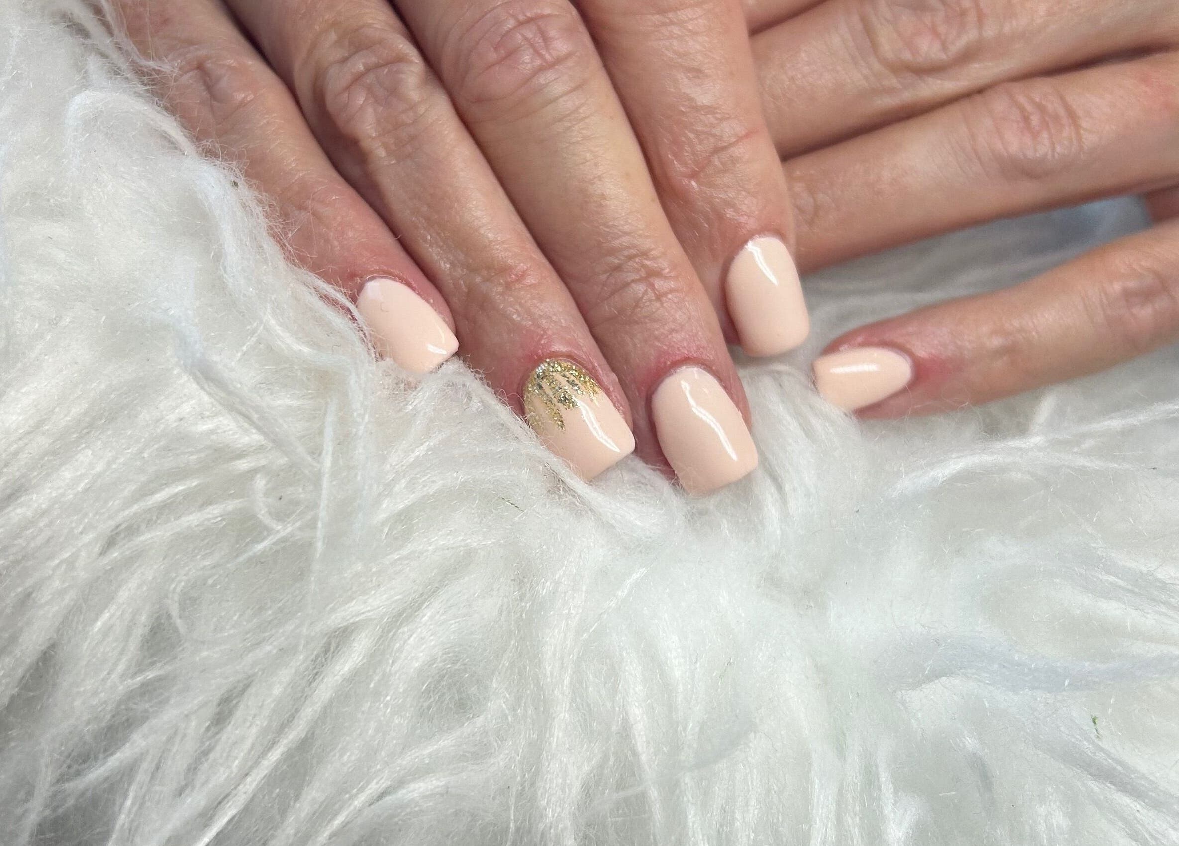 Beautiful nude nails with gold accent from The Glamour Room, Gorey, County Wexford, IE, showcasing elegance.