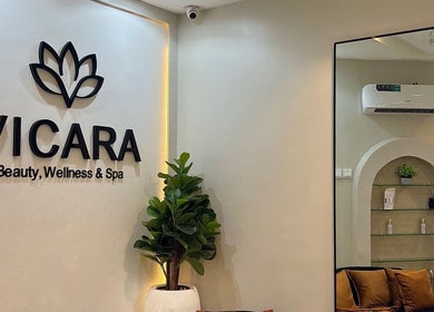 Entrance of Vicara Spa & Wellness in Abuja, Federal Capital Territory, NG. Elegant interior with lush plants.