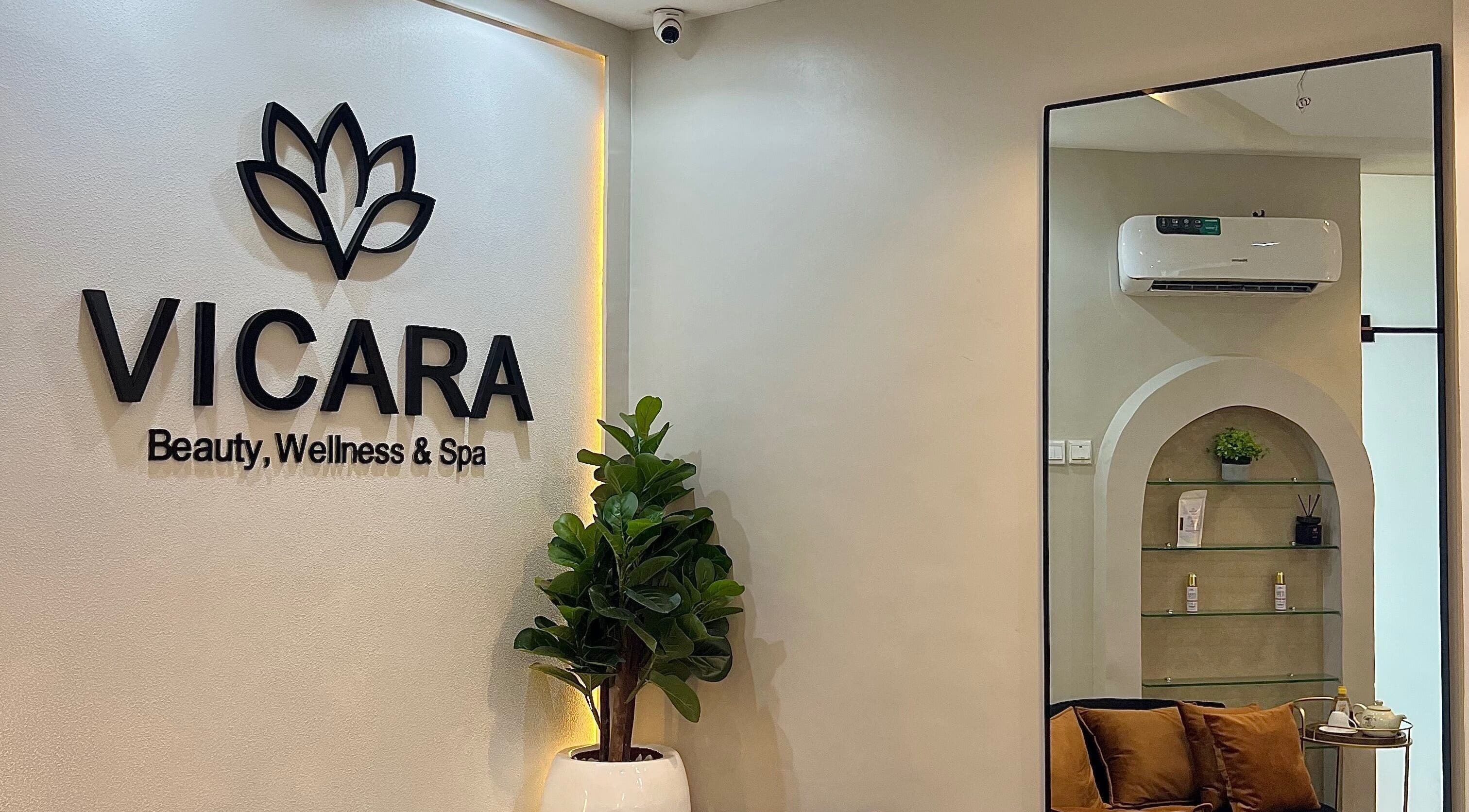 Entrance of Vicara Spa & Wellness in Abuja, Federal Capital Territory, NG. Elegant interior with lush plants.