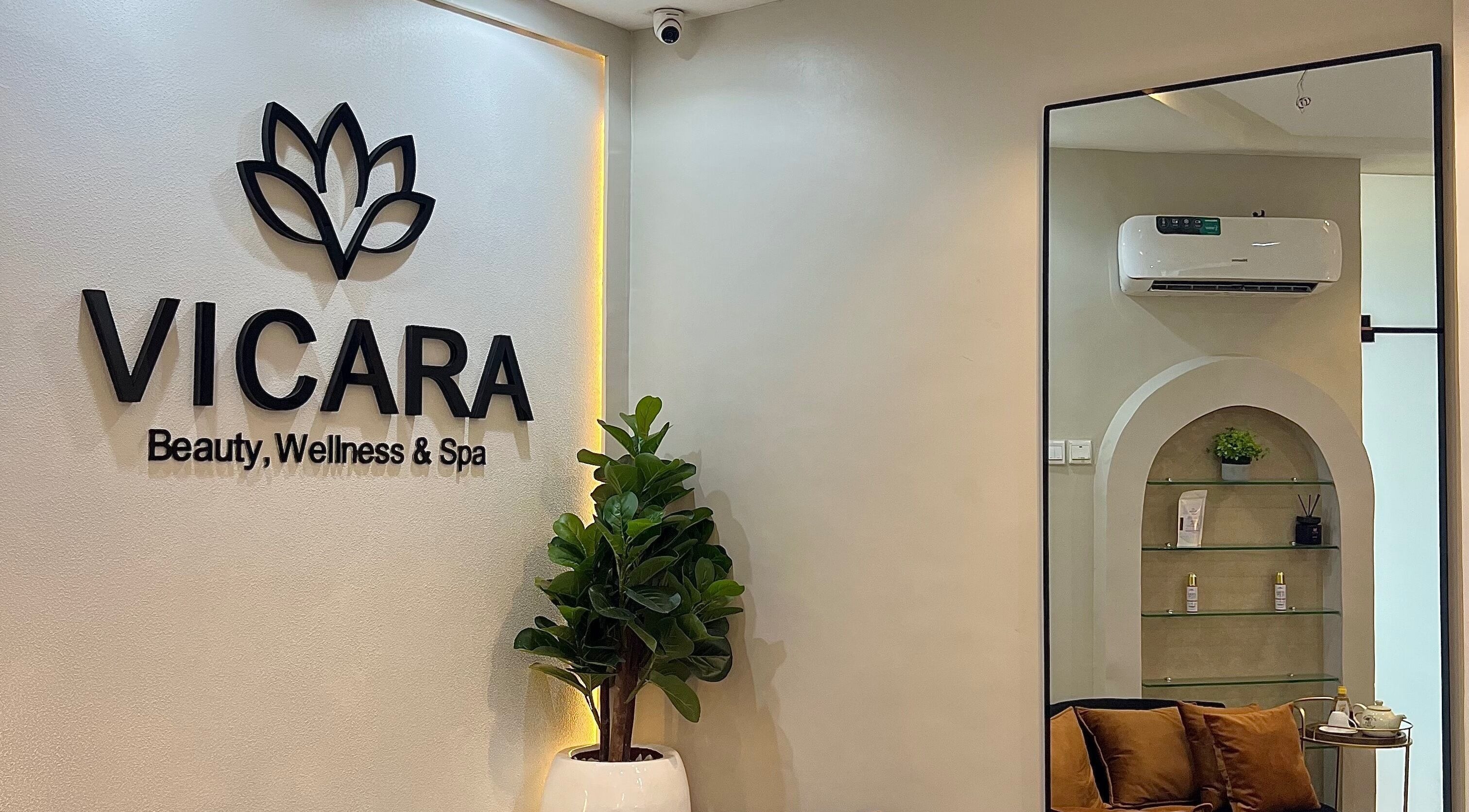 Entrance of Vicara Spa & Wellness in Abuja, Federal Capital Territory, NG. Elegant interior with lush plants.