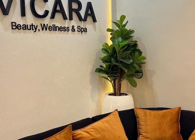 Vicara Spa & Wellness entrance in Abuja, Federal Capital Territory, NG with cozy seating and green plant.