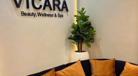 Vicara Spa & Wellness entrance in Abuja, Federal Capital Territory, NG with cozy seating and green plant.
