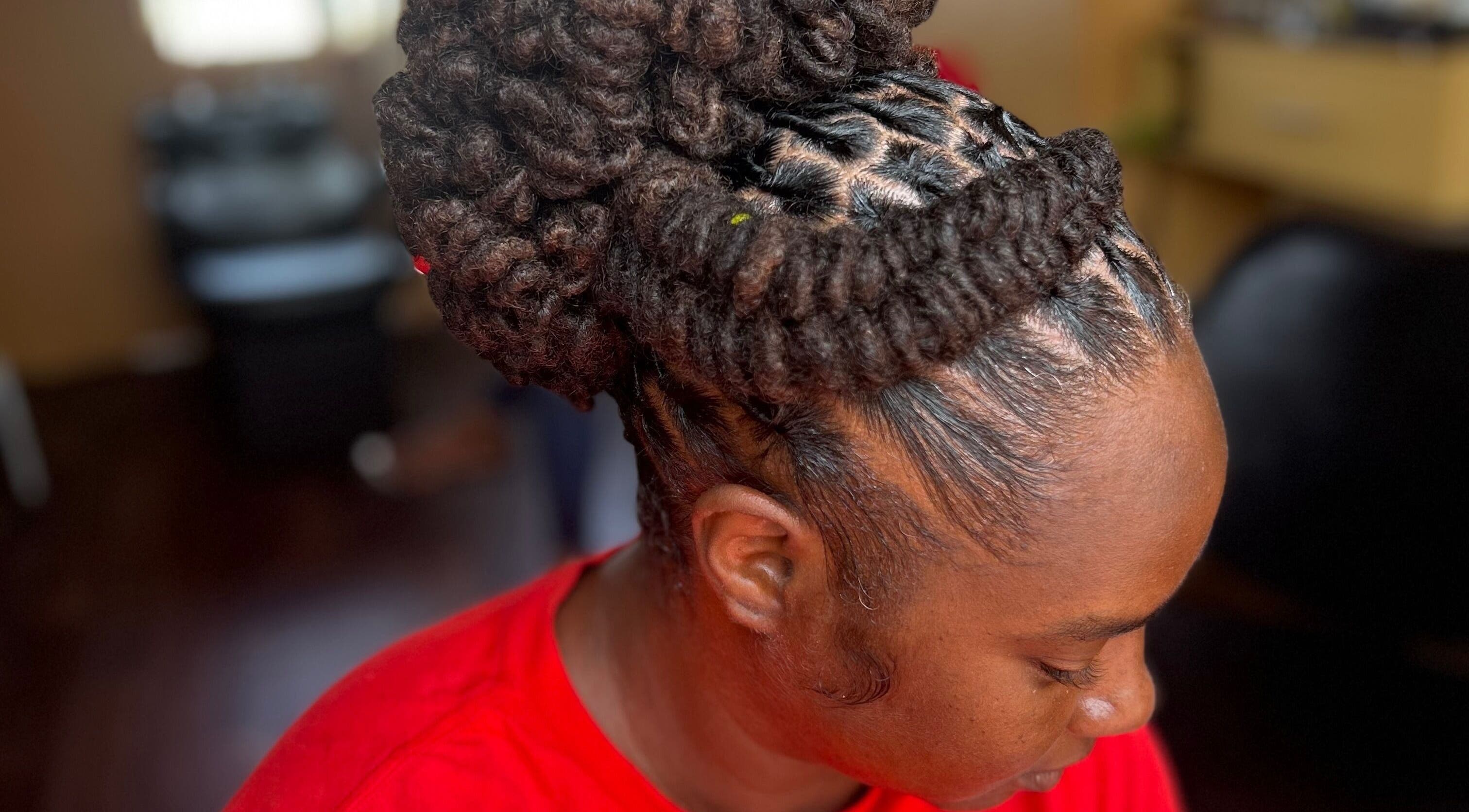 Intricate braided hairstyle created at LoudXtensions, Bridgetown, Saint George, BB. Stylish and professional look.