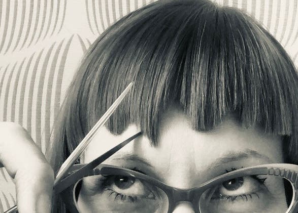 Close-up of chic fringe haircut at Simone * This Is Who We Are Collective, Leeds, England, GB.