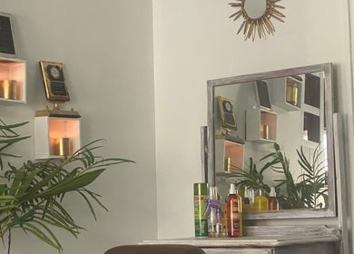 Chic salon interior at Stylin' Chic by Auldine's, Kingstown, St. George, VC with plants and beauty products.