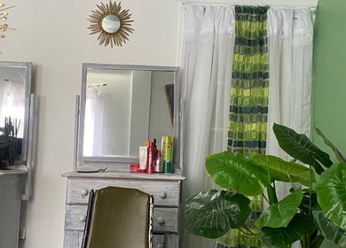 Stylish beauty station at Stylin' Chic by Auldine's, Kingstown, St. George, VC with mirrors and plant decor.