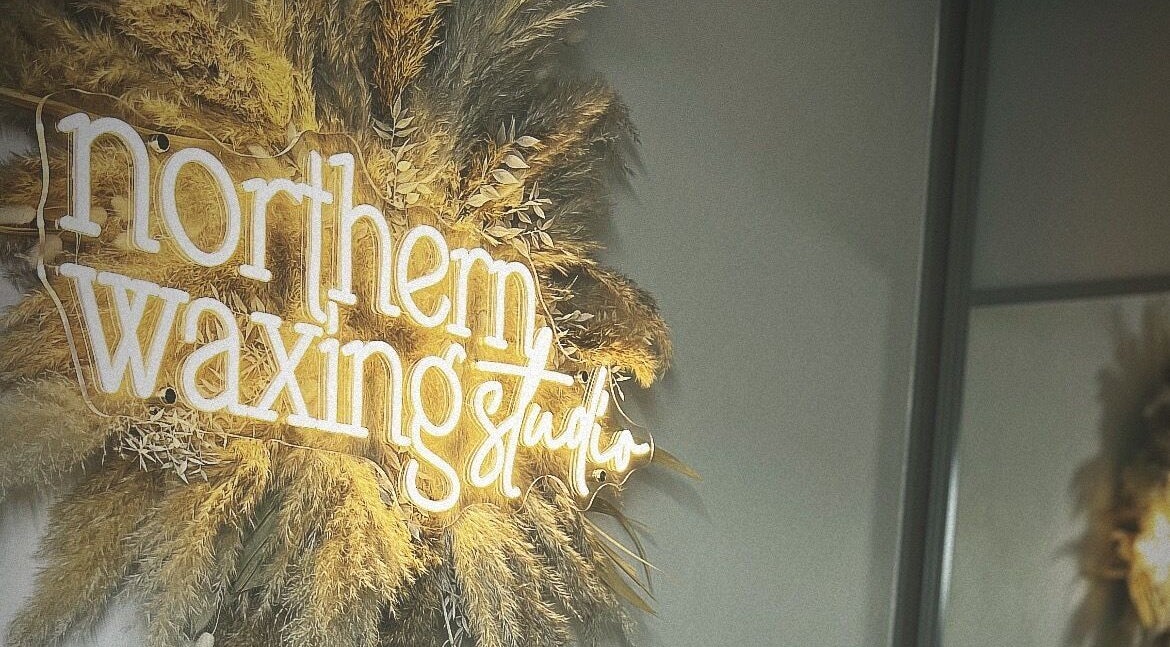 Elegant Northern Waxing Studio sign in Hebburn, England, GB with pampas grass decor.