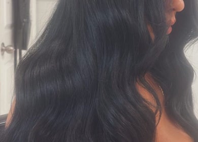 Client with sleek, black wavy hair at Melval Hair Studio, Toronto, Ontario, CA.