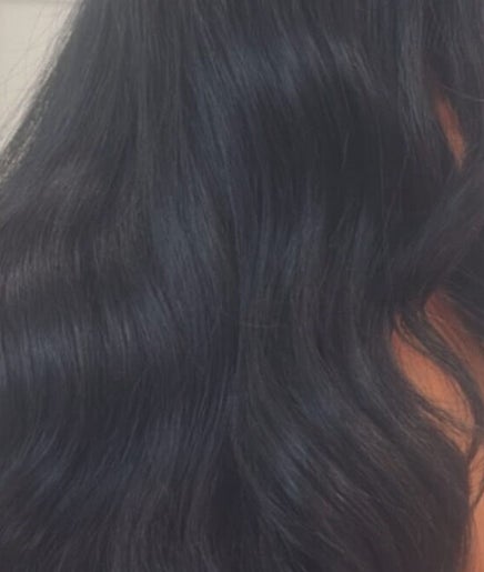 Client with sleek, black wavy hair at Melval Hair Studio, Toronto, Ontario, CA.