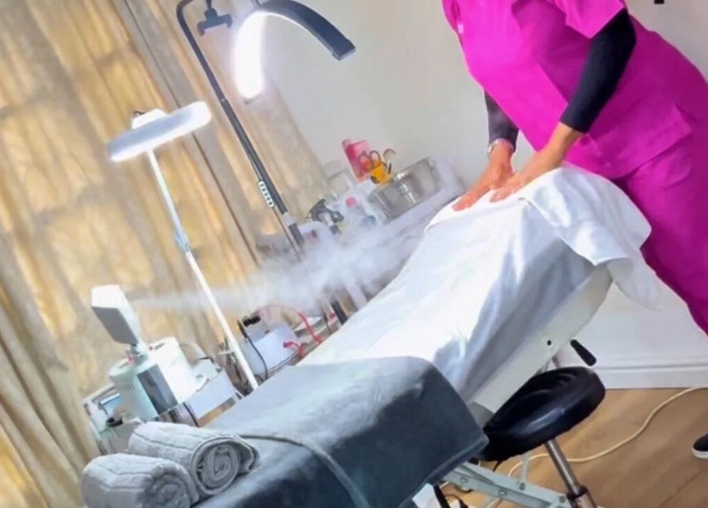 Relaxing treatment room at BeautyHuntt Aesthetics Clinic, Lekki, Lagos, NG with massage table and soft lighting.