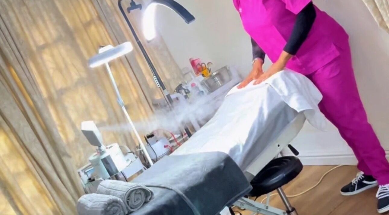 Relaxing treatment room at BeautyHuntt Aesthetics Clinic, Lekki, Lagos, NG with massage table and soft lighting.