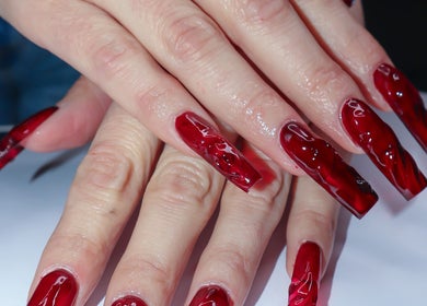 Elegant red nail art at Yanice Gianina Nails, Berlin, Berlin, DE showcasing intricate design.