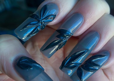 Elegant 3D nail art at Yanice Gianina Nails in Berlin, Berlin, DE showcasing intricate dark floral designs.