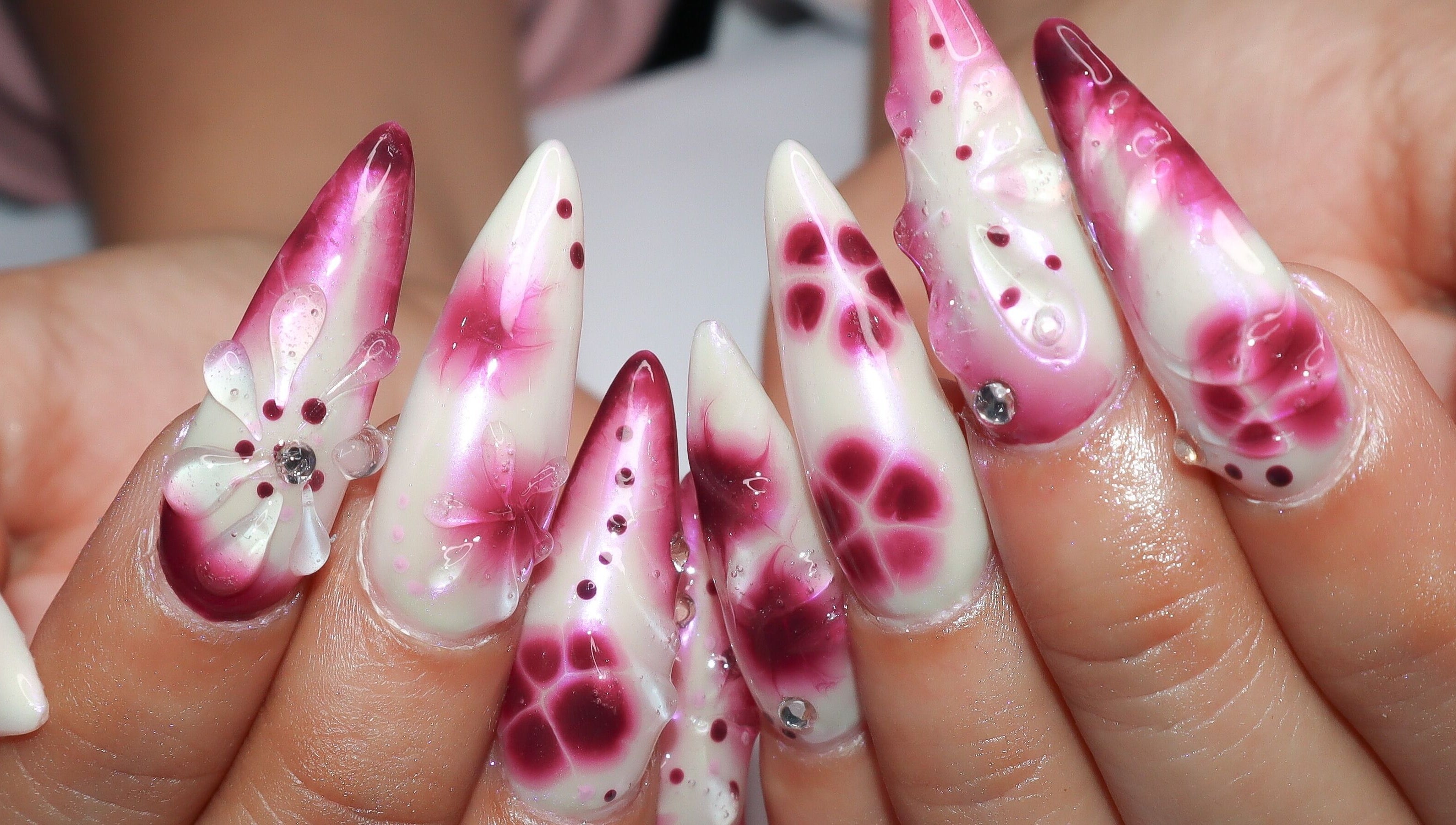 Elegant floral nail art at Yanice Gianina Nails, Berlin, Berlin, DE with intricate purple and pink designs.