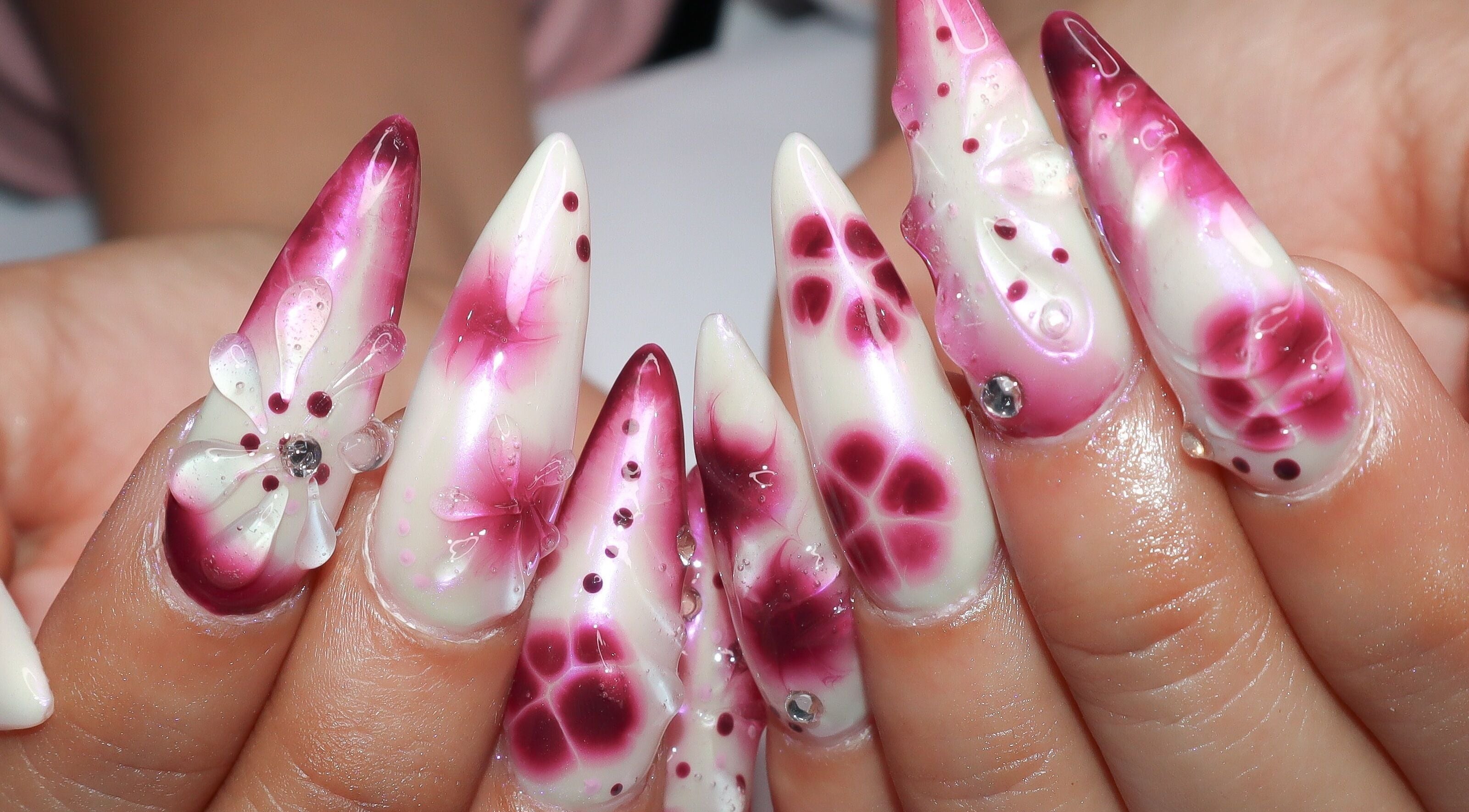Elegant floral nail art at Yanice Gianina Nails, Berlin, Berlin, DE with intricate purple and pink designs.