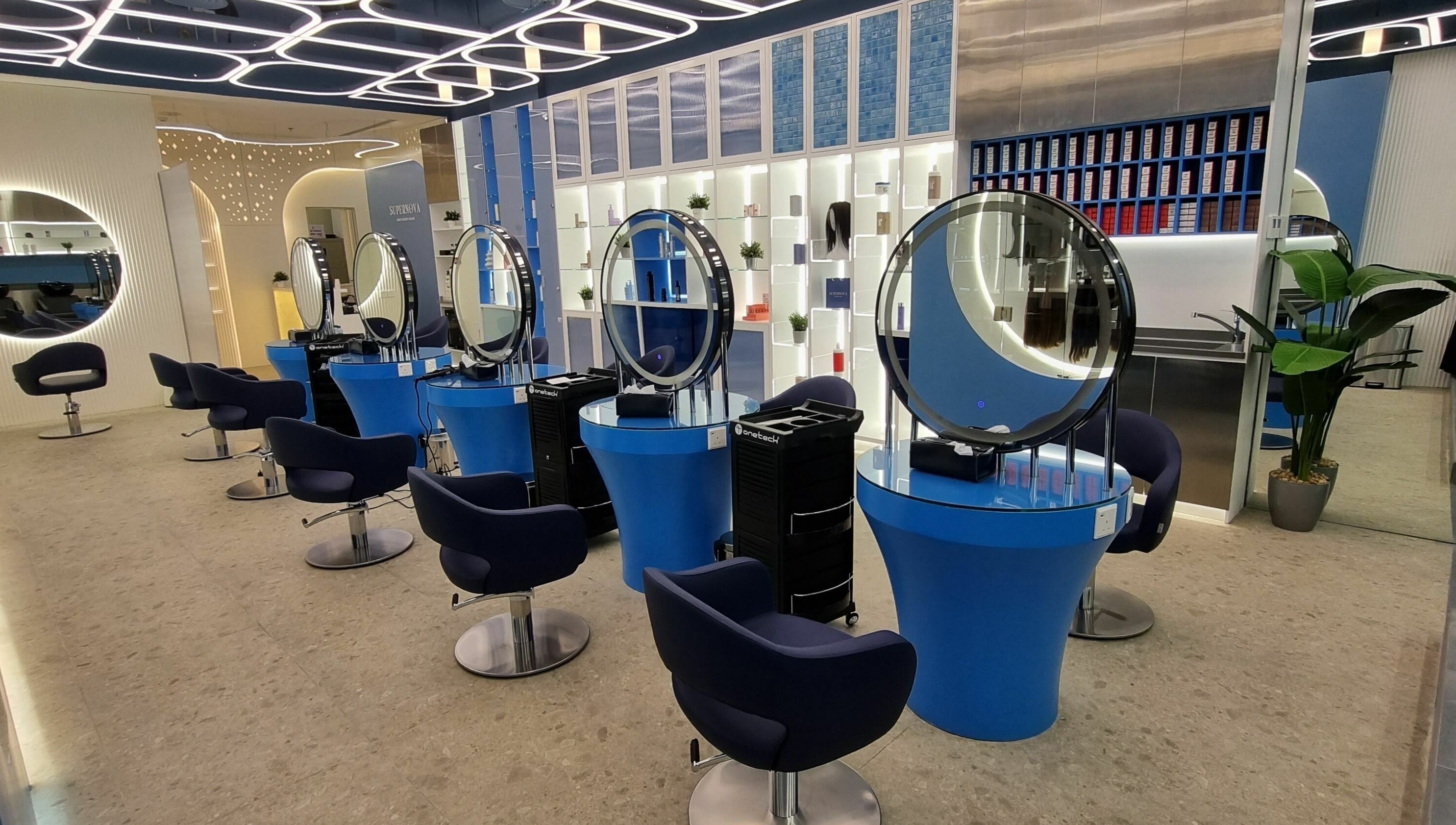 Modern interior of Supernova Salon Murooj in Riyadh, Riyadh Province, SA with chic styling stations.