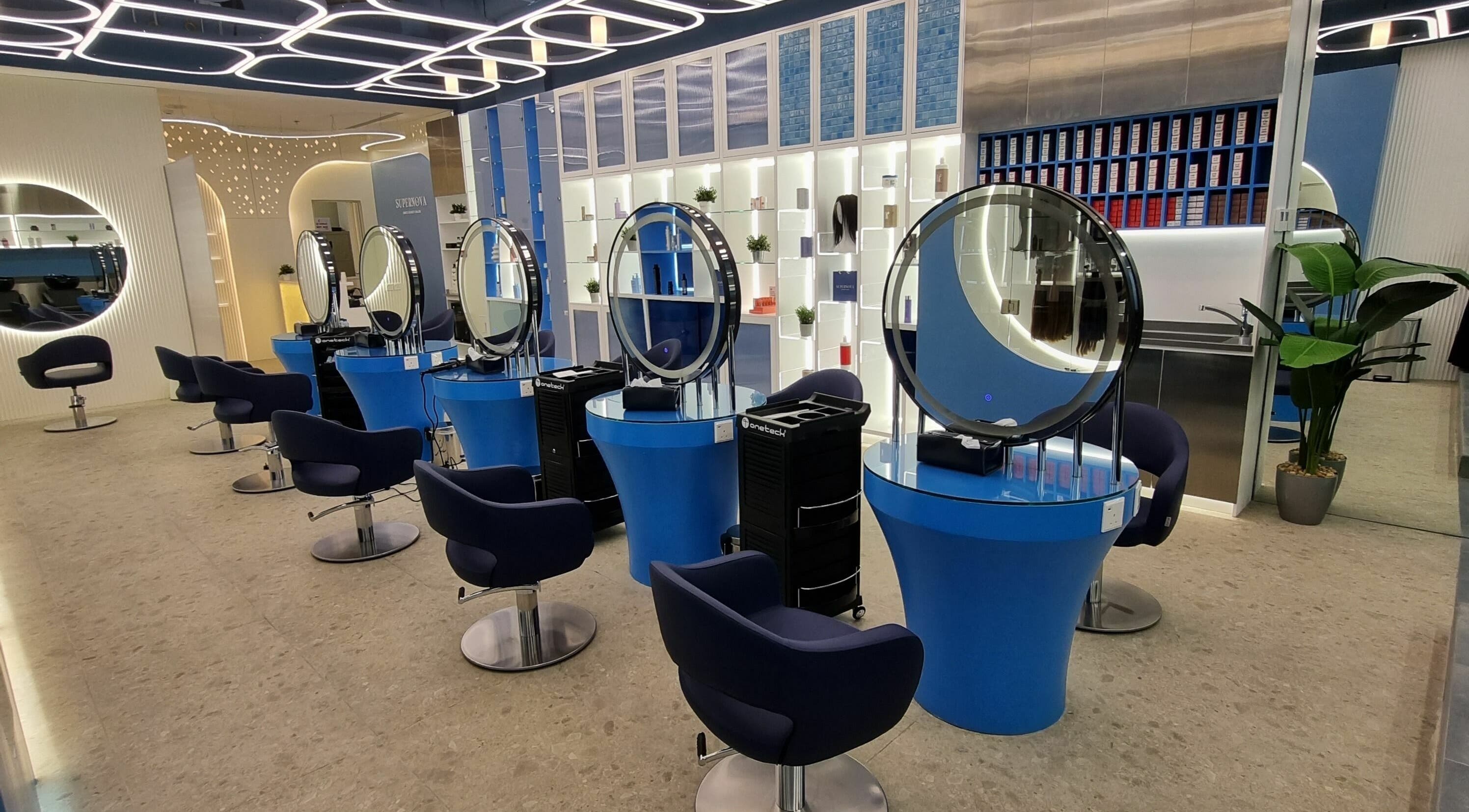 Modern interior of Supernova Salon Murooj in Riyadh, Riyadh Province, SA with chic styling stations.