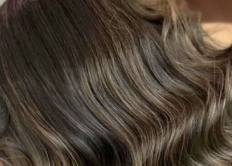 Elegant, wavy brown hair styled beautifully at Supernova Salon Olaya, Riyadh, Riyadh Province, SA.