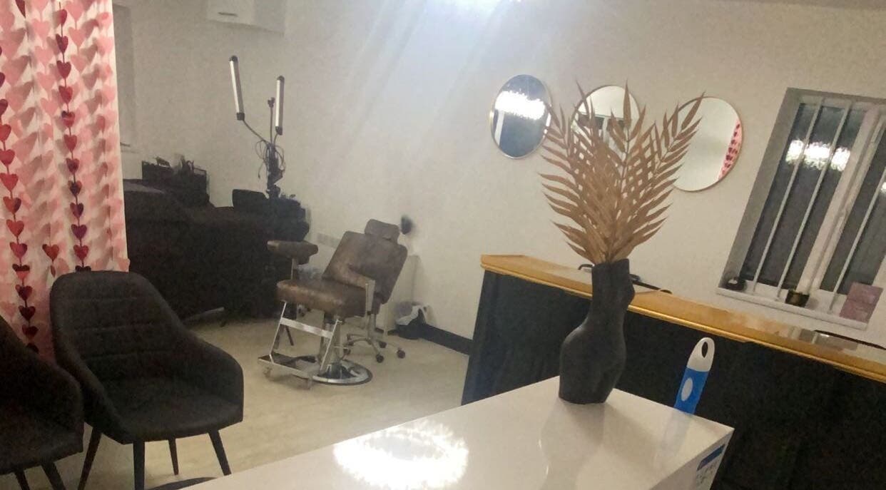 Inviting interior of More Than Aesthetics in Parkgate, England, GB featuring elegant chairs and chic decor.