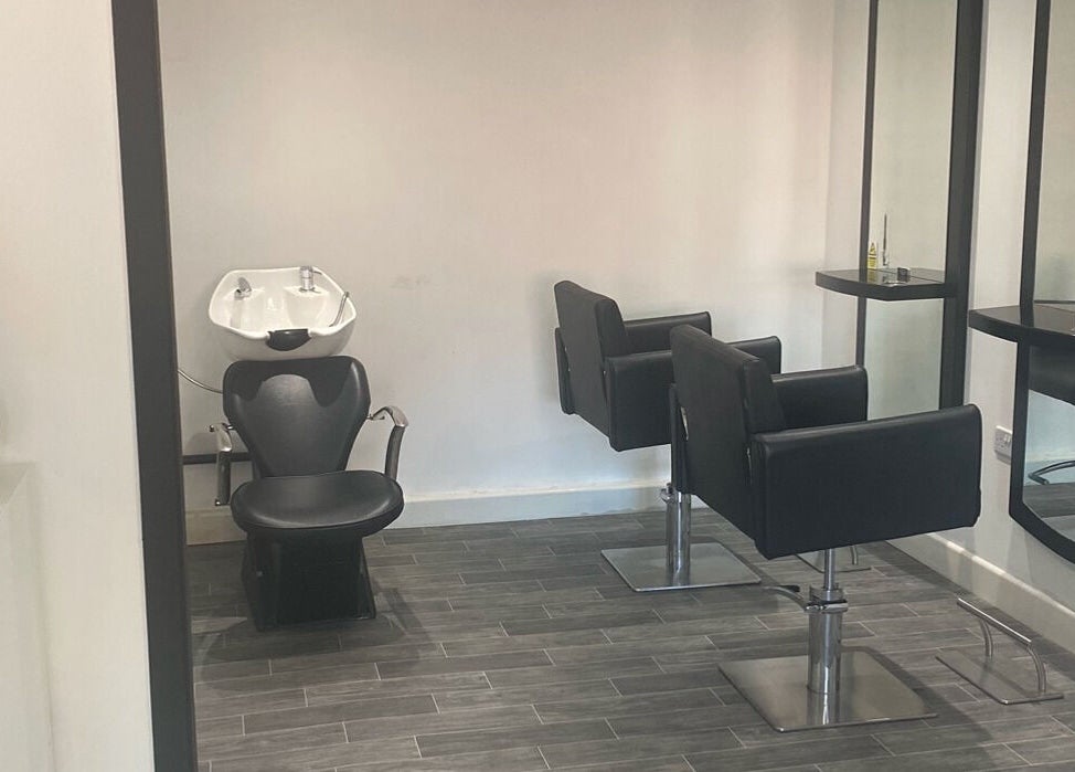 Modern hair styling chairs and mirrors at More Than Aesthetics, Parkgate, England, GB.